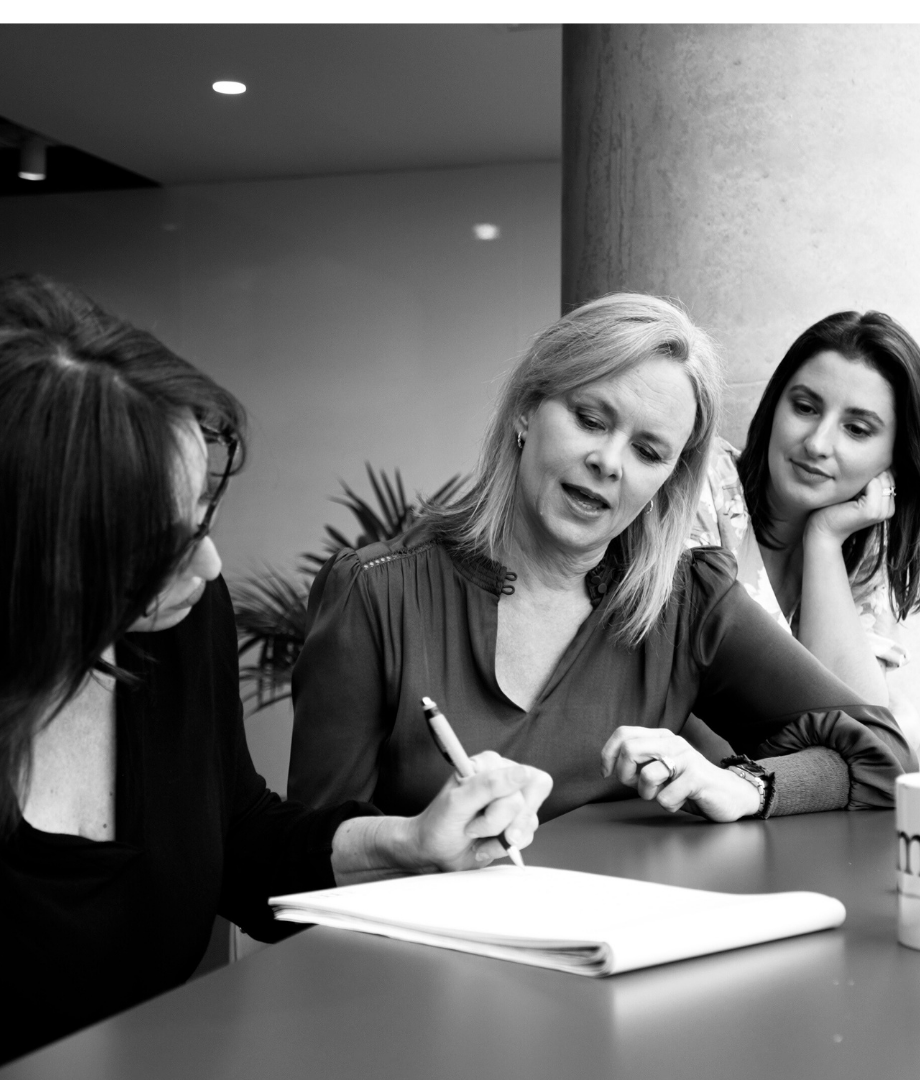 Emerging leaders page (2) The CSA team sitting down discussing a document