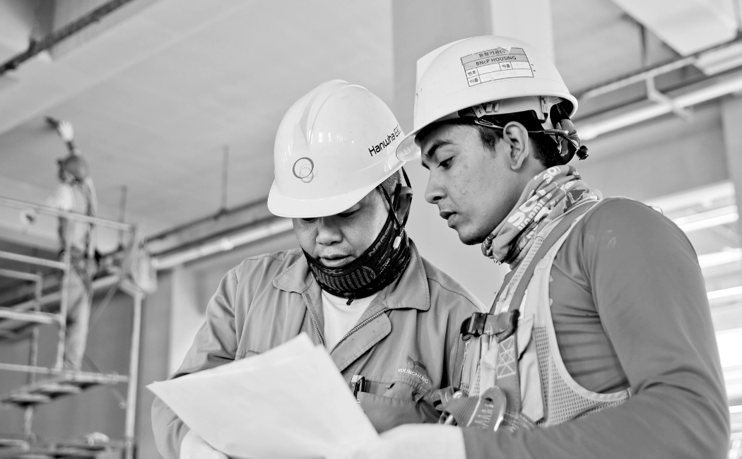 Engineers discussing their plans at work