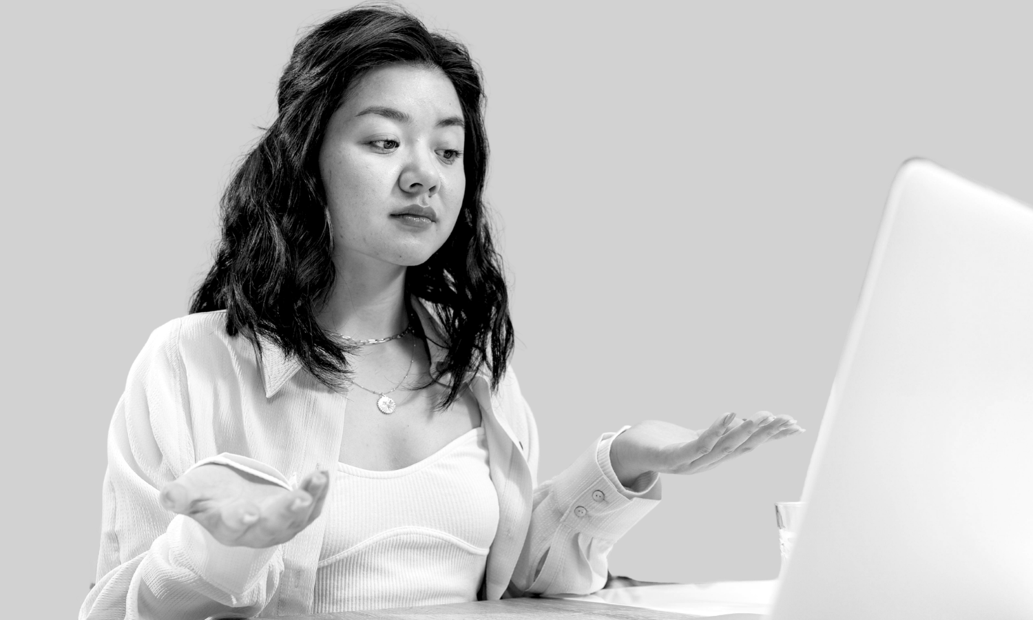 Woman confused looking at her computer screen
