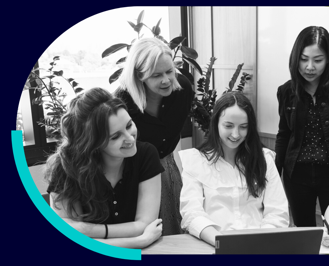 CSA team discussing what's on the laptop